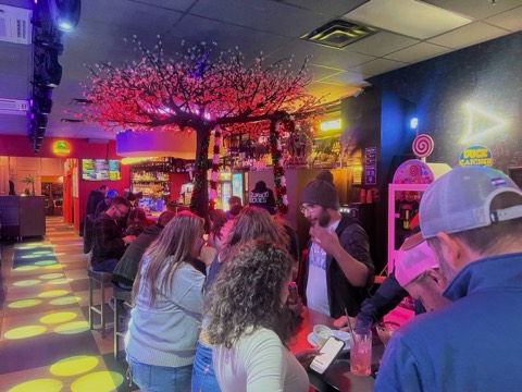A busy night at The Flipside under the cherry-blossom lights